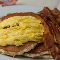 Lumberjack · Buttermilk pancakes or challah French toast or Belgian waffle topped with two eggs and bacon...