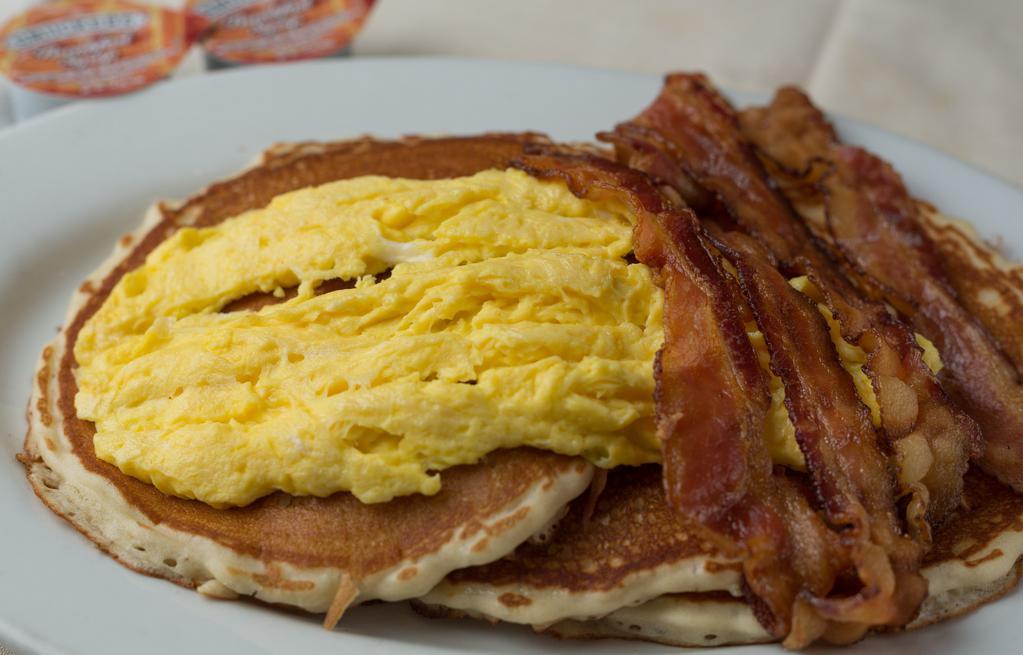 Lumberjack · Buttermilk pancakes or challah French toast or Belgian waffle topped with two eggs and bacon or ham or sausage.