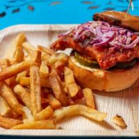 Nashville Hot Chicken Sandwich · Nashville spicy hot sauce, fried chicken, 'slaw & Pickles