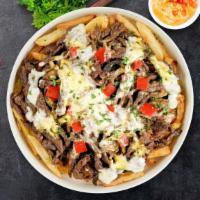 Philly Wonka Loaded Fries · Steak, caramelized onions, bell peppers, and melted cheese topped on Idaho potato fries.