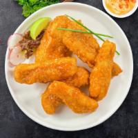 Buffalo Halo Tenders · Chicken tenders breaded and fried until golden brown before being tossed in buffalo sauce.