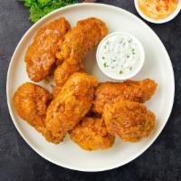 Takes Two To Mango Habanero Tenders · Chicken tenders breaded, fried until golden brown before being tossed in mango habanero sauce.