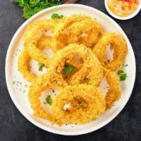 Onion Bling Ring · (Vegetarian) Sliced onions dipped in a light batter and fried until crispy and golden brown.