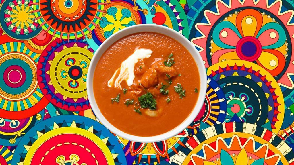 Awadhi Butter Chicken · Tender chunks of char grilled tandoori chicken in a  creamy and deliciously smooth butter, tomato and cream based gravy , spiced with ginger, garlic and aromatic whole spices, served with a side of our aromatic basmati rice