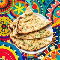 Garlic Blast Naan  · House made pulled and leavened dough loaded with fine chopped garlic and baked to perfection...