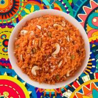 Carrot Halwa  · Fine grated carrots cooked till tender in milk and clarified butter infused with cardamom