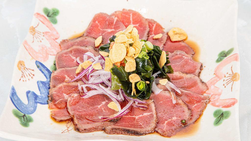 Beef Tataki · Thinly sliced of rare beef with vinegar sauce.