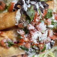 Flautas · 2 rolled up crispy taquitos
stuffed w/chicken or cheese.
Finish with refrided beans, lettuce...