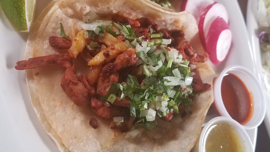 Carne Enchilada Taco · Spicy pork. Made on double corn tortilla with cilantro, onions, radishes, and lime.