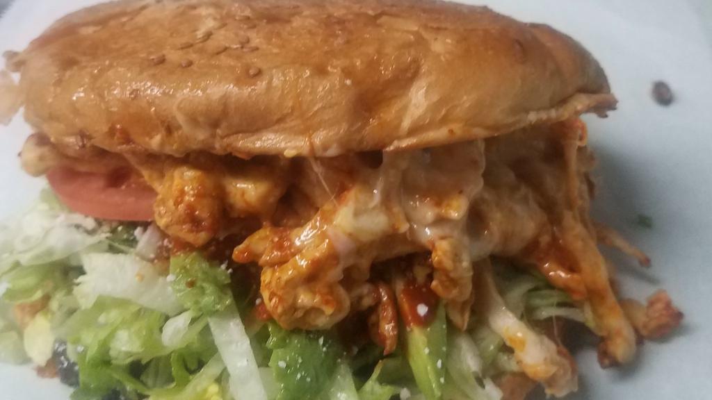Pollo Cemita · Chicken. Puebla style sandwich. Sesame roll, beans, lettuce, tomatoes, onions, cheese, avocado, papalo, chipotle sauce, and mayonnaise.