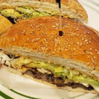 Carnitas Cemita · Roasted pork. Puebla style sandwich. Sesame roll, beans, lettuce, tomatoes, onions, cheese, ...