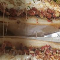 Chorizo Cemita · Puebla style sandwich. Sesame roll, beans, lettuce, tomatoes, onions, cheese, avocado, papal...