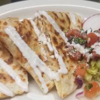 Tinga Quesadilla · Shredded chicken breast mix with chipotle. Made on 10