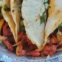 Tacos (3Pcs) · Homemade corn tortilla,  
choice of meat, cilantro, onion
radishes & lime wedges.