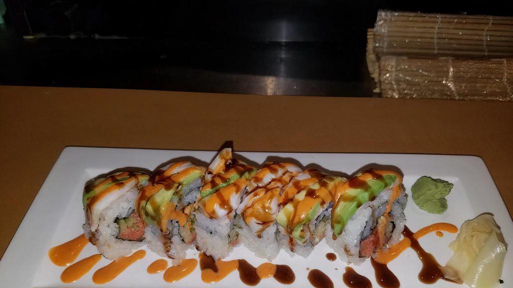 Snow White · Spicy tuna, cucumber and avocado; topped with white tuna.