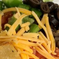 Tossed Salad · Mixed greens topped with vine-ripened tomatoes, fresh bell peppers, sliced black olives, Che...