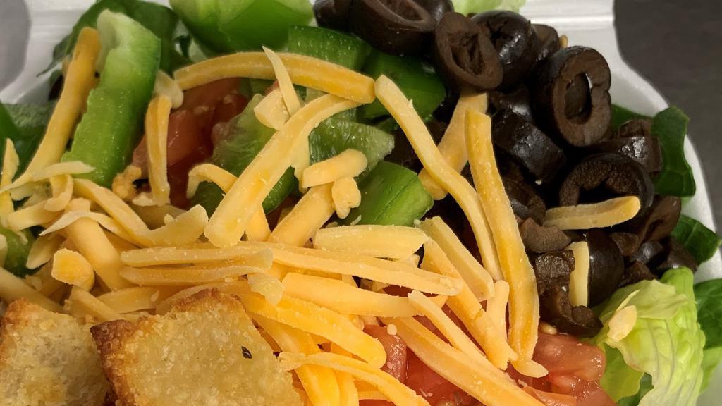 Tossed Salad · Mixed greens topped with vine-ripened tomatoes, fresh bell peppers, sliced black olives, Cheddar cheese, and homemade croutons.