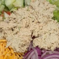 Tuna Salad · Mixed greens topped with vine-ripened tomatoes, onions, cucumbers, celery, Cheddar cheese an...