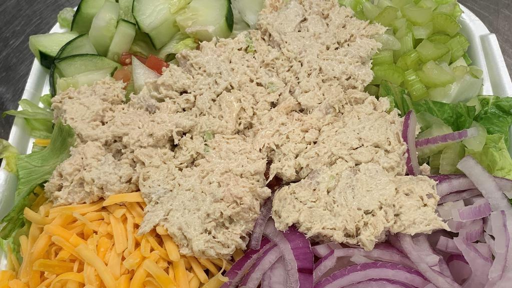 Tuna Salad · Mixed greens topped with vine-ripened tomatoes, onions, cucumbers, celery, Cheddar cheese and a scoop of albacore tuna.