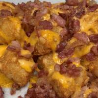Dd Tots · Loaded with cheese sauce and bacon.