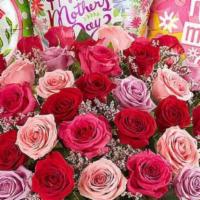 Love You To The Moon And Back · Beautiful mix 12 color roses in a vase.
Includes a small box of chocolates and small teddy b...