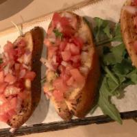 Bruschetta · Freshly grilled italian bread topped with a blend of finely diced tomatoes, red onions, garl...