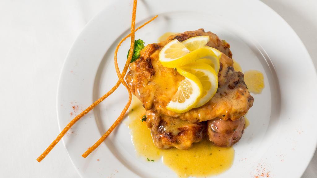 Pollo Francese · Chicken breast dipped in egg batter, sautéed until golden brown and served in a lemon white wine sauce.