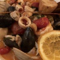 Zuppa Di Pesce · Shrimp, mussels, clams, calamari, scallops in a hot or sweet marinara sauce over linguini.