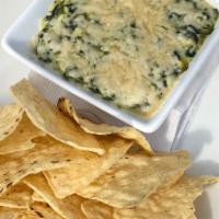 Spinach And Artichoke Dip · Spinach and artichoke hearts with garlic, cream cheese,  romano and parmesan cheese. Served ...
