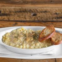 Creamy Mac N Cheese  · Homemade smooth and creamy mac n cheese topped with crispy breadcrumbs. Served with garlic b...