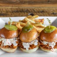 Pulled Pork Sliders · 3 BBQ pulled pork sliders on Challah buns topped with coleslaw and pickles.