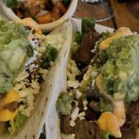  3 Steak Tacos · Three warmed flour tortillas with guacamole, salsa verde, pico de gallo & queso fresco toppe...