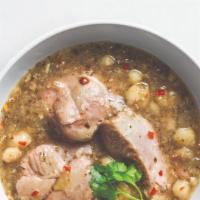 Pozole Verde · Diced pork and hominy stewed in green chile tomatillo broth served with radish, onion, cilan...