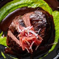 Bistec Con Salsa Verde Mole · Seared Sierra steak with mole-spiked demi sauce, salsa verde and pickled onions served with ...