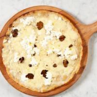 Round Tartufo Nero · Bouquet of Italian cheeses, homemade truffle sauce, black truffle. (white pizza)
