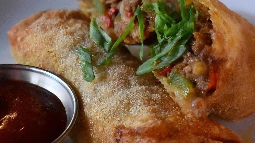 Southwest Springrolls · cherry peppers, american cheese, grilled onions, chipotle ketchup