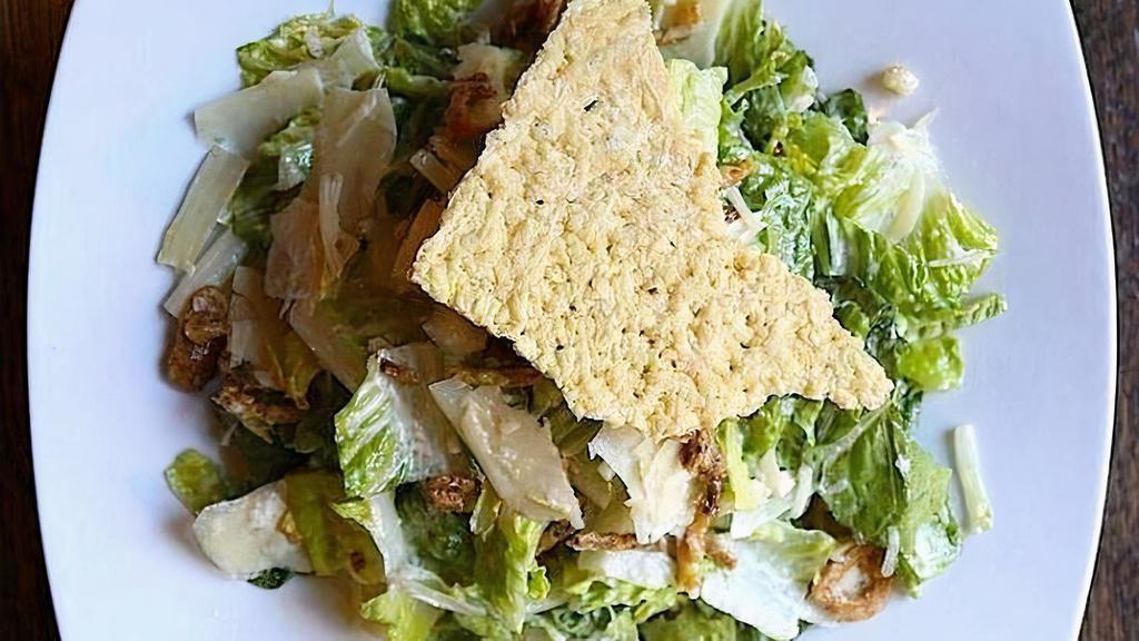 Caesar Salad · romaine hearts, parmesan crisp, garlic croutons, crispy shallots, classic dressing
