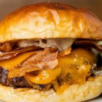 Steakhouse Burger · Angus beef, thick cut bacon, caramelized onions, cheddar, garlic aioli