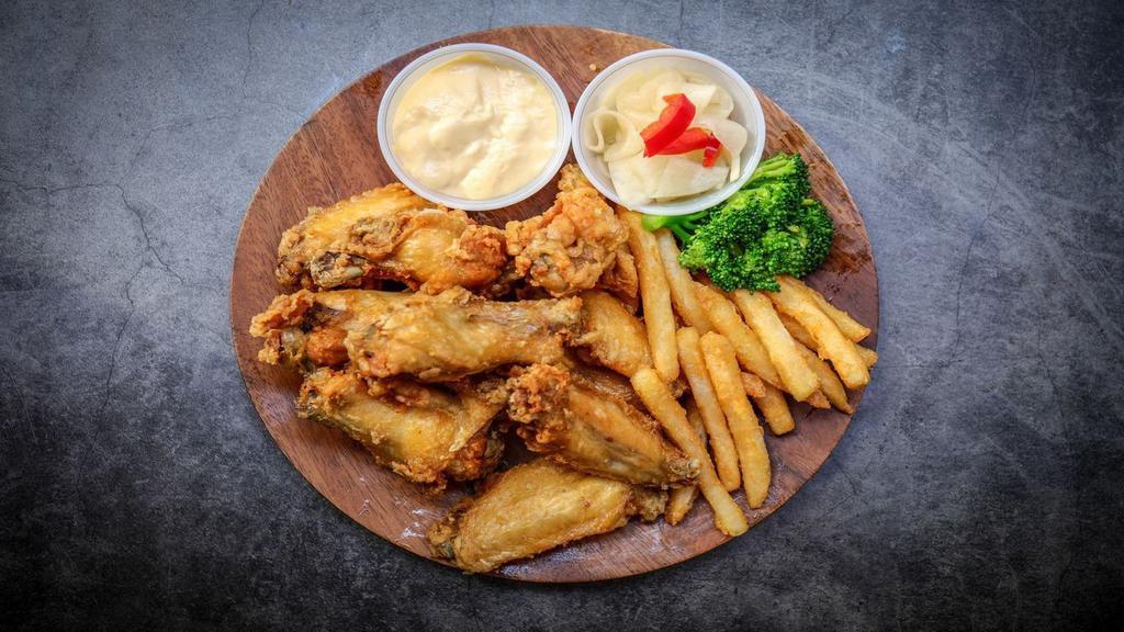 Fried Chicken (10Pcs) · Fried chicken wings with french fries.