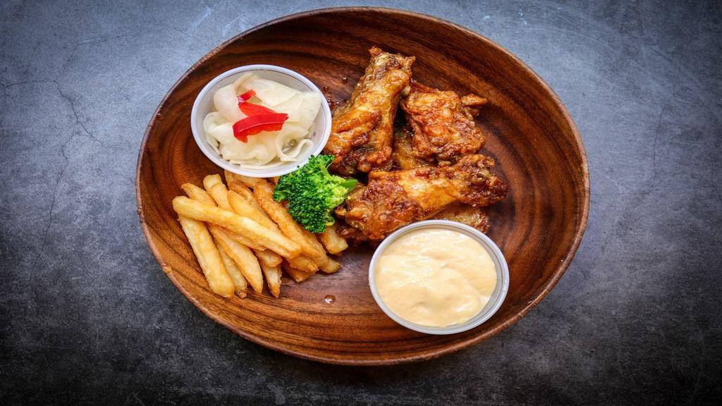 Fried Chicken (5Pcs) · Fried chicken wings with french fries.