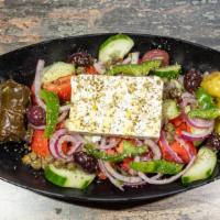 Horiatiki · Vegetarian.Fresh tomatoes, cucumbers, red onions, imported feta cheese, Kalamata olives, Gre...