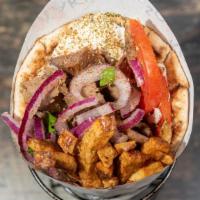 Lamb Gyro Pita Sandwich · Mouthwatering, slow roasted slices of our delicious lamb gyro, carved off a vertical rotisse...