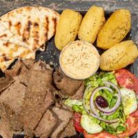 Lamb Gyro Platter · Double portion of our slow roasted lamb gyro, over your choice of up to 2 sides and choice o...