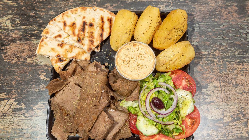 Lamb Gyro Platter · Double portion of our slow roasted lamb gyro, over your choice of up to 2 sides and choice of dip. Served with a house salad and pita bread.