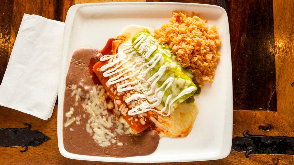 Enchiladas Bandera · Three corn tortillas, one with chicken, one with beef and one with cheese. Topped with three different sauces. Served with your choice of rice or beans.