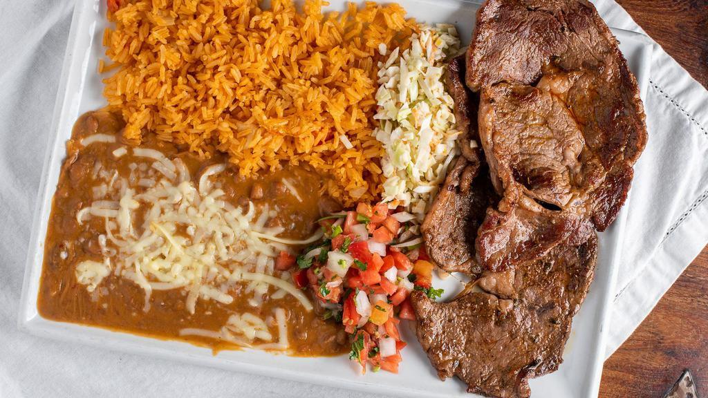 Carne Asada · Tender steak served wtih rice, beans, pico de gallo, and flour tortillas.