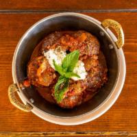 Yiayia'S Meatballs · Traditional and freshly ground beef meatballs served over a white navy bean stew “fasolatha”...