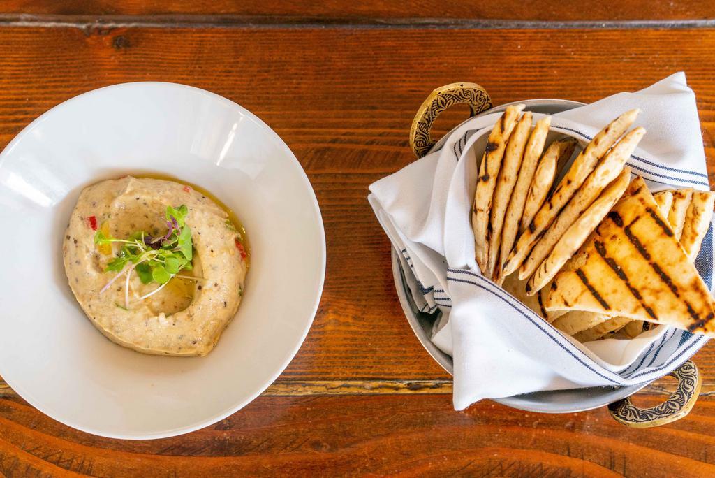 Eggplant Spread · Grilled eggplant puree spread blended with yogurt, walnuts, and served with grilled pita bread.