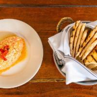 Red Pepper Feta Spread · Roasted red pepper puree with feta cheese “htipiti” spread that is served with grilled pita ...