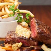 16 Oz. Flame Grilled New York Strip Steak · Hand cut fries & Seasonal roasted vegetables